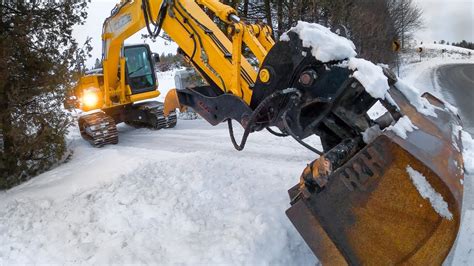 snow plowing with mini excavator|mini excavators for snow removal.